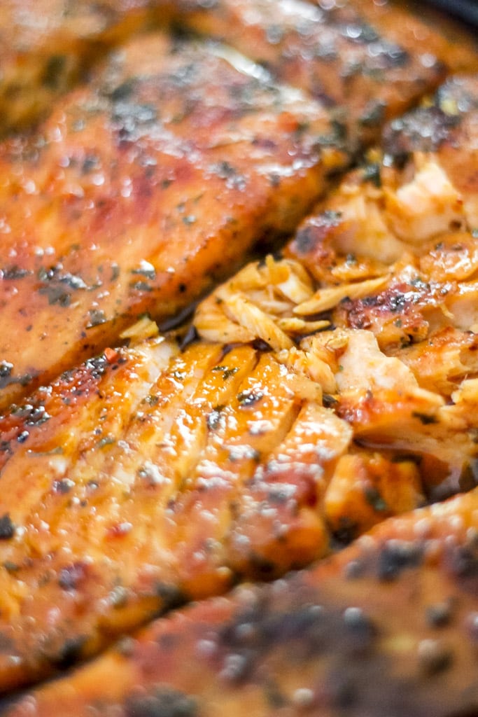 sriracha honey glazed salmon in skillet.