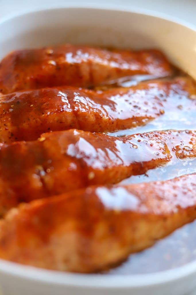 sriracha honey sauce poured overtop of salmon.