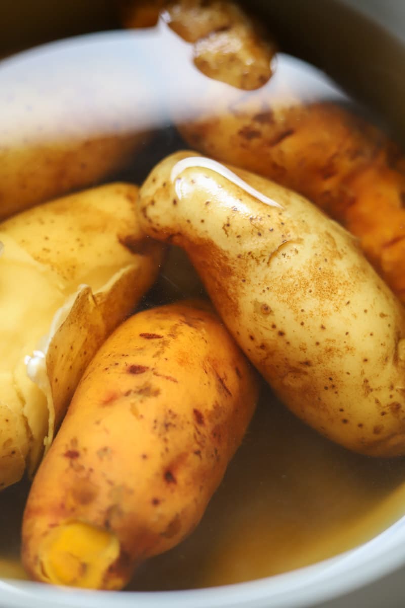 potatoes submerged in water in a pot