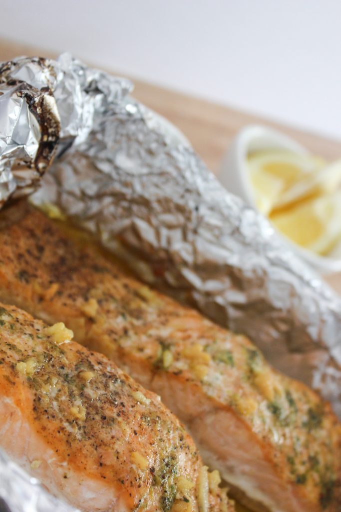 close up view of garlic butter salmon in foil