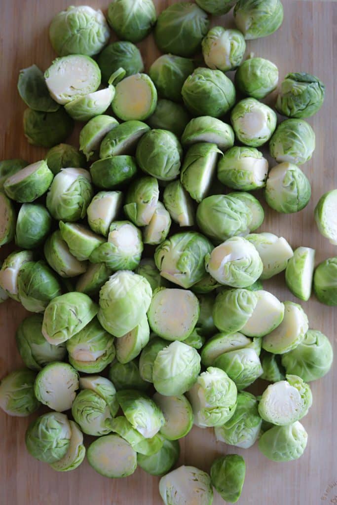 halved brussels sprouts on cutting board.