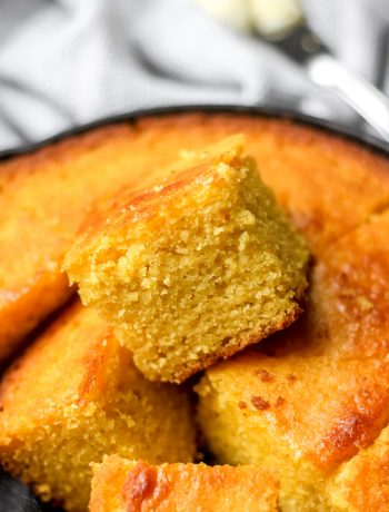Easy Classic Buttermilk Cornbread in skillet cut into squares