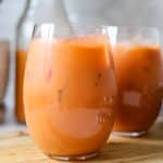 jamaican carrot juice poured into two glasses.