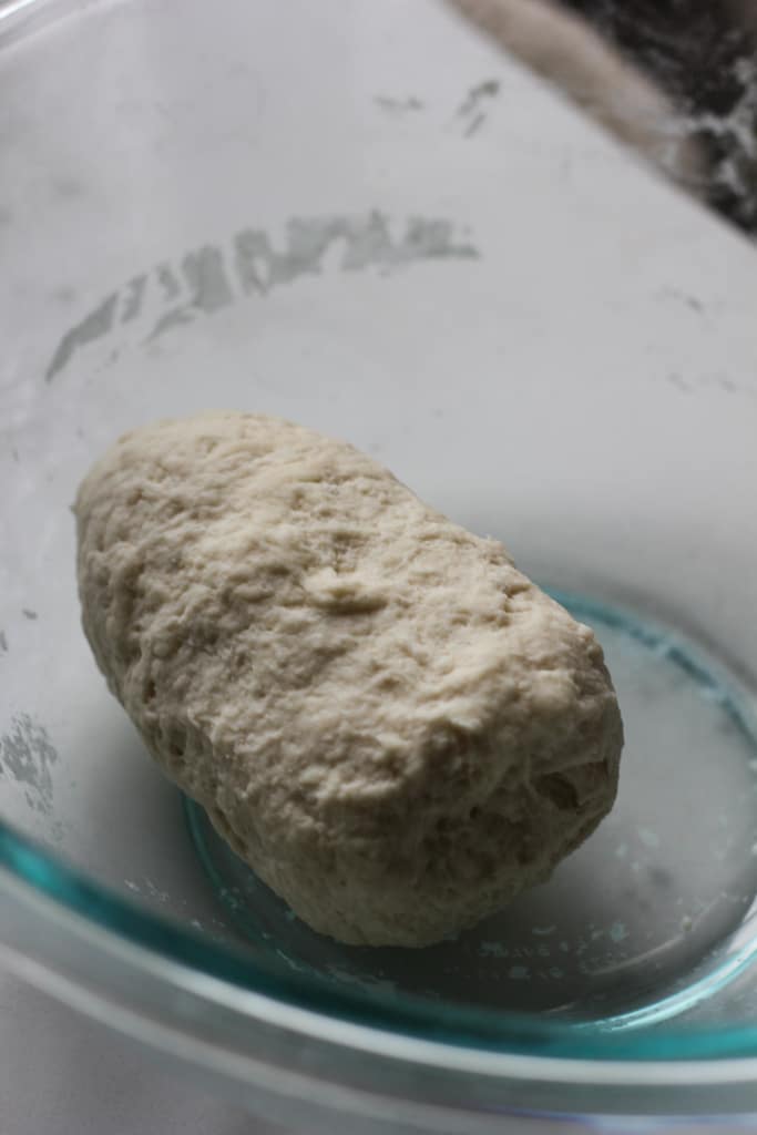 flour dumpling dough in glass bowl.