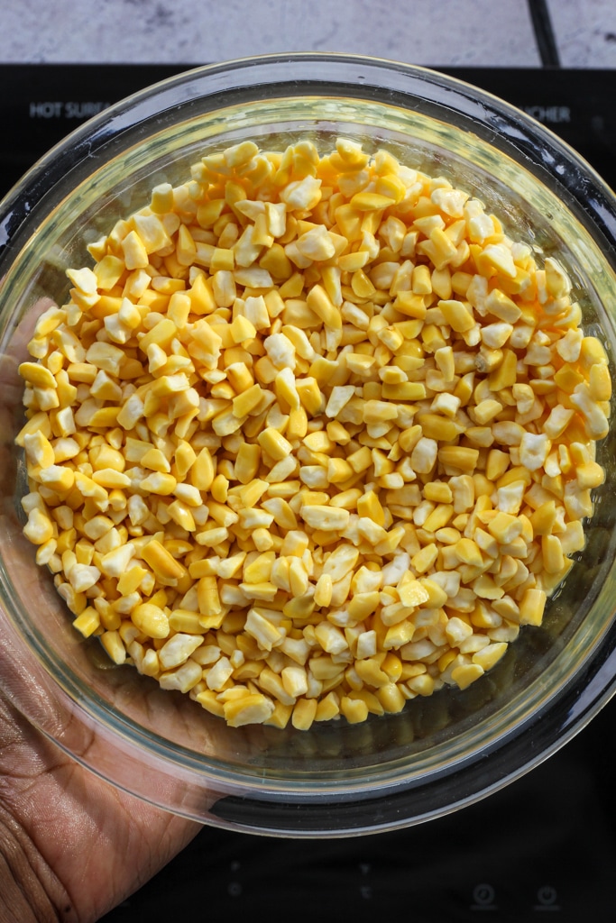 hominy corn kernels in glass bowl.