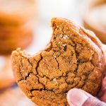 Soft and Chewy Ginger Molasses Cookies in hand