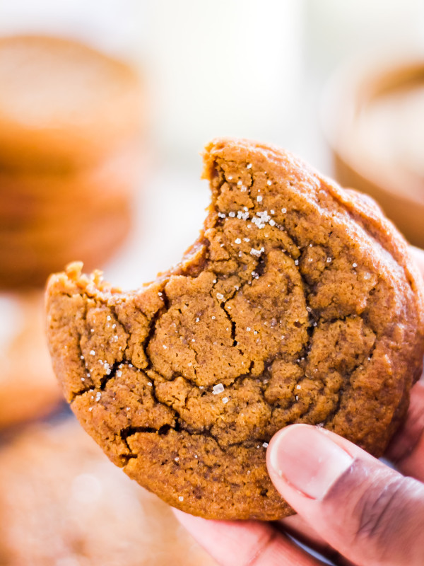 Soft and Chewy Ginger Molasses Cookies in hand
