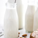 How to Make the BEST Almond Milk (Dairy-Free & Vegan)_Featured Image_in Small Glass Jugs