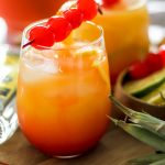 Tropical Rum Punch in Glass on Wooden Plank