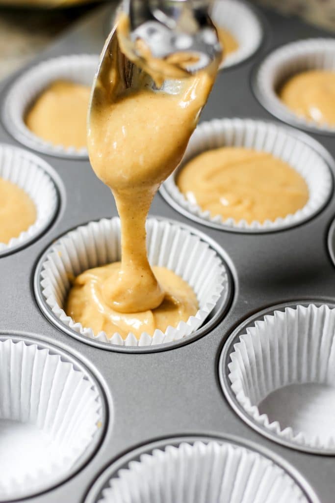 Pouring Easy Coffee Cake Muffins Batter in Muffin Tray