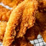 Double-Coated Cornflake Crumb Fried Chicken Strips on Black Wired Basket