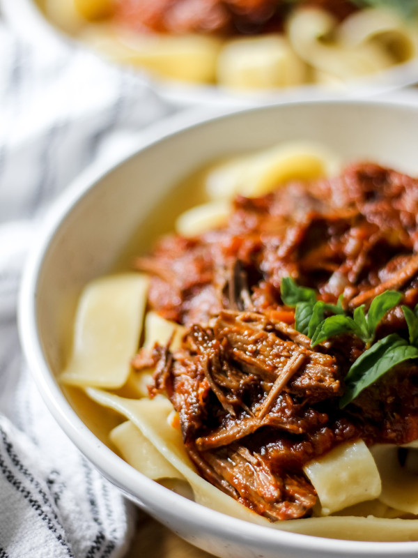 Slow Cooked Beef Ragu with Pappardelle in grey speckled bowl