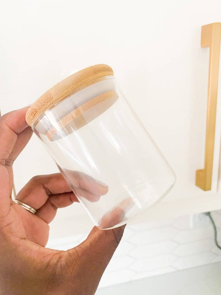 Clear Spice Jar with Bamboo Lid in Hand