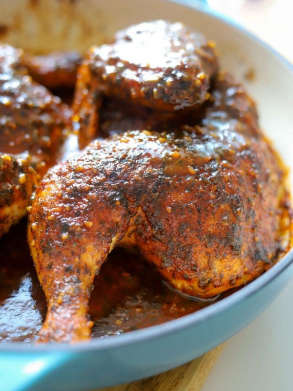 baked pesto chicken in teal lodge cast iron pan