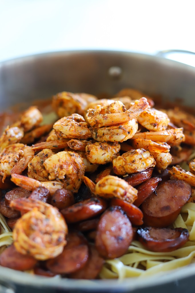 shrimp, sausage, and pasta in pan.