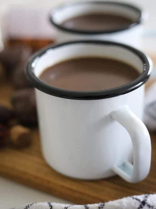 jamaican cocoa tea in two enamel mugs.
