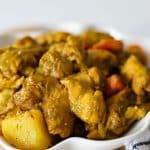Caribbean curry chicken with fresh thyme and pimento in creamy curry sauce.