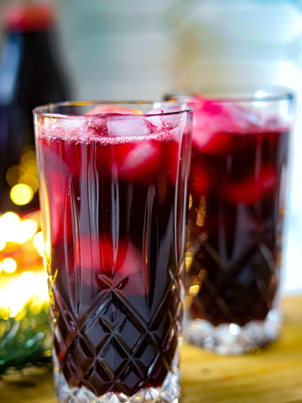 jamaican sorrel drink in two glasses with ice.