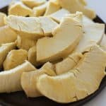 pieces of roasted breadfruit on the plate.pieces of roasted breadfruit on the plate.
