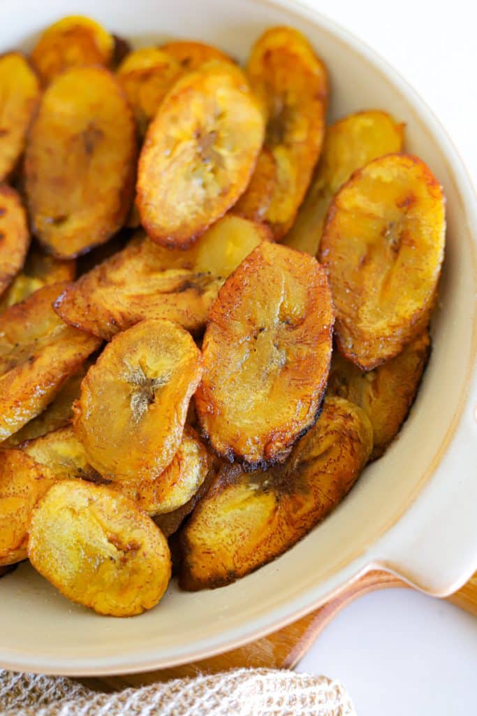 a plate of sliced fried plantains.