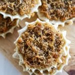 gizzada tarts on a wooden board.