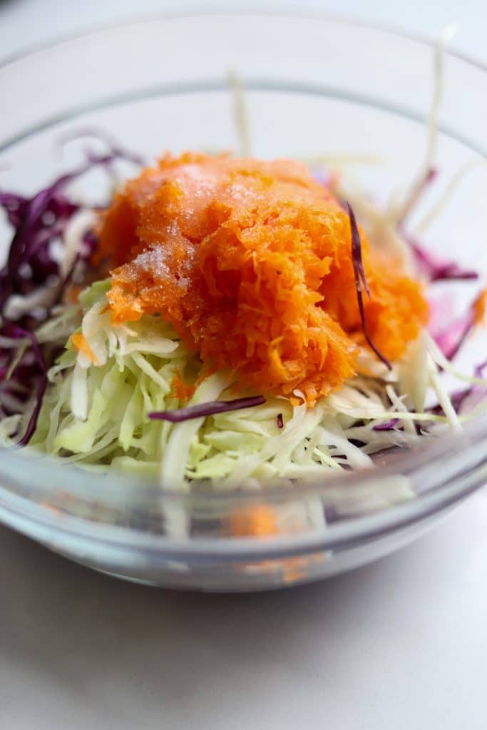 shredded red cabbage, green cabbage and carrots with sugar and vinegar.