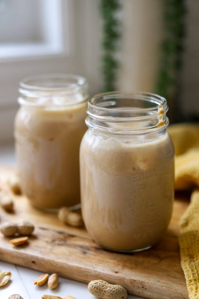 jamaican peanut punch  in two mason jars.