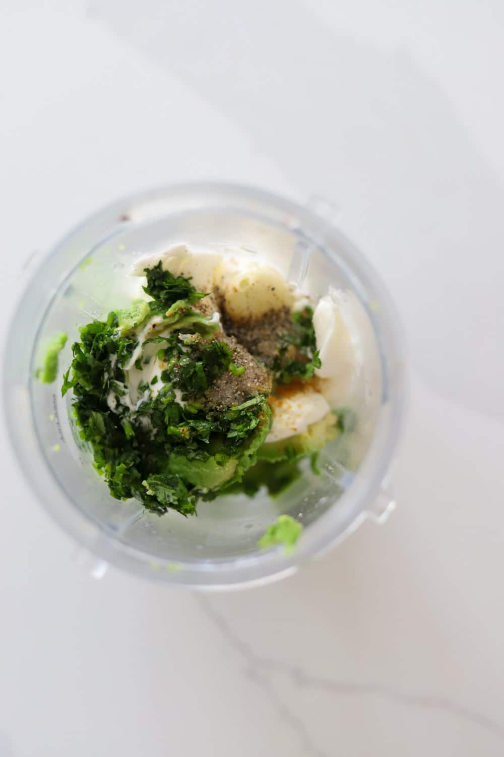 Avocado crema ingredients blended smooth for jerk chicken tacos