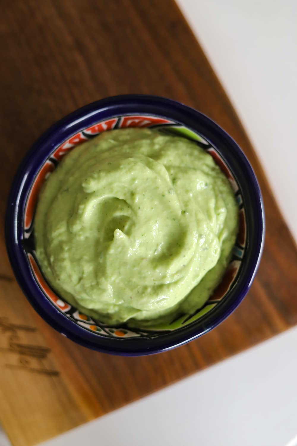 Creamy avocado crema sauce for Jamaican jerk chicken tacos