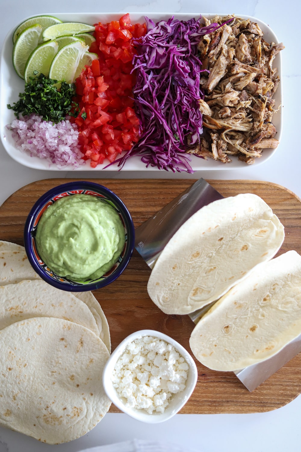 Ingredients for Jamaican jerk chicken tacos laid out on a surface