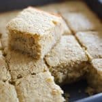 jamaican coconut cake sliced in cake pan.