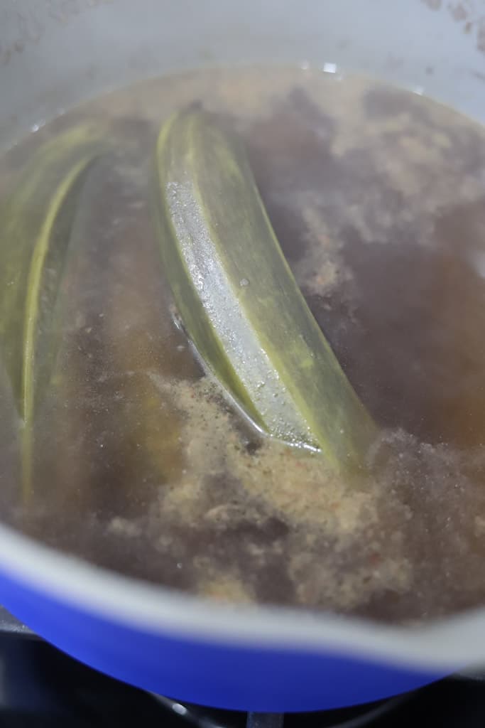 green bananas in boiling water