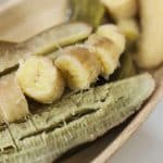 close up view of boiled green bananas with a few pieces sliced