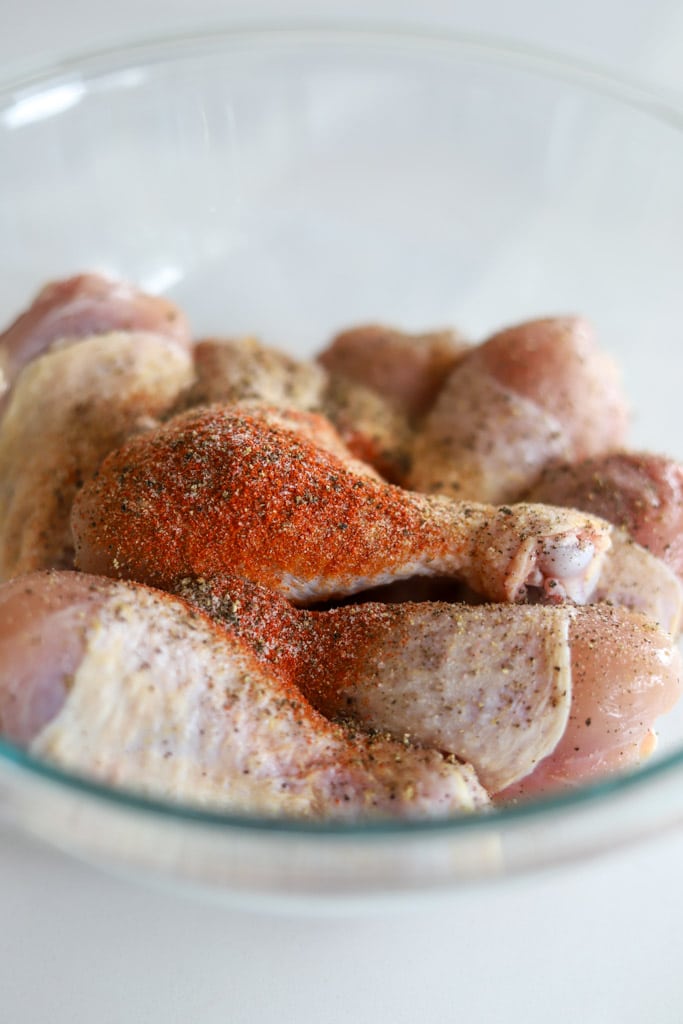 seasoning added to chicken legs.