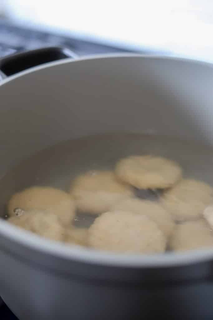 green banana boiled dumplings in pot boiling.