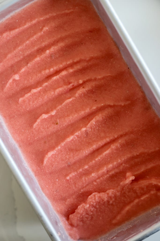 watermelon sorbet added to a loaf pan