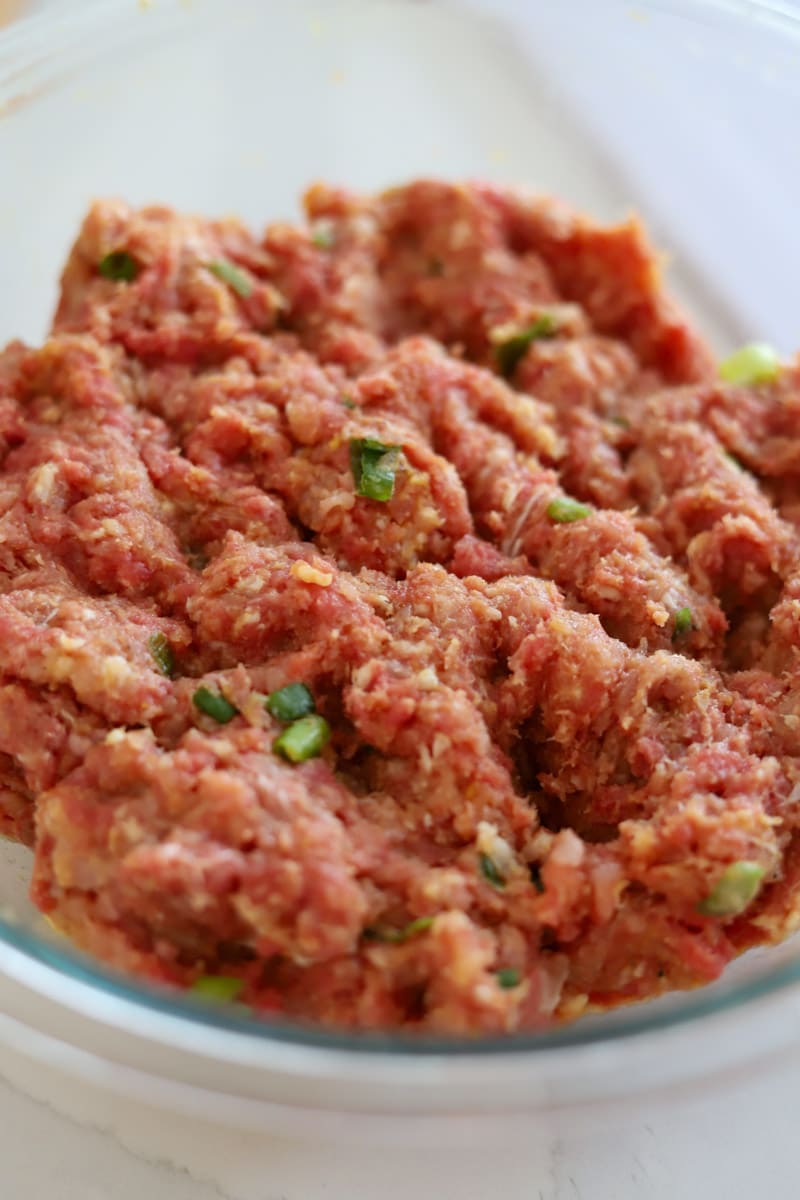 sweet and sour meatballs ground meat combined in bowl.