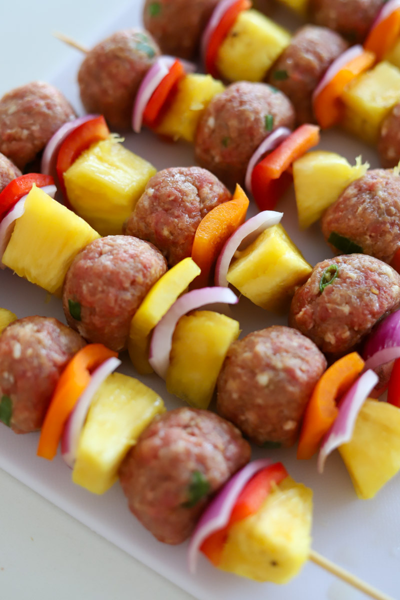 meatball skewers with pineapple, bell peppers, and red onions.