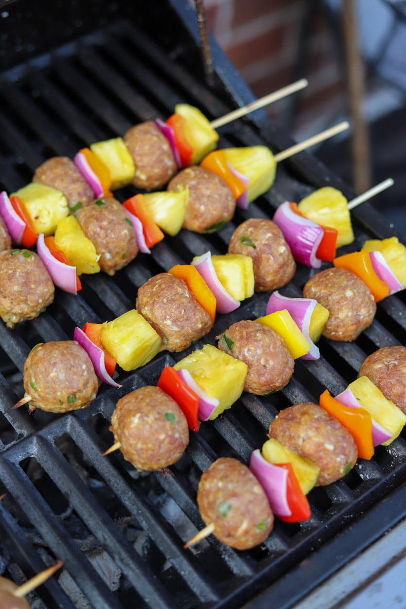 sweet and sour meatball skewers on grill.