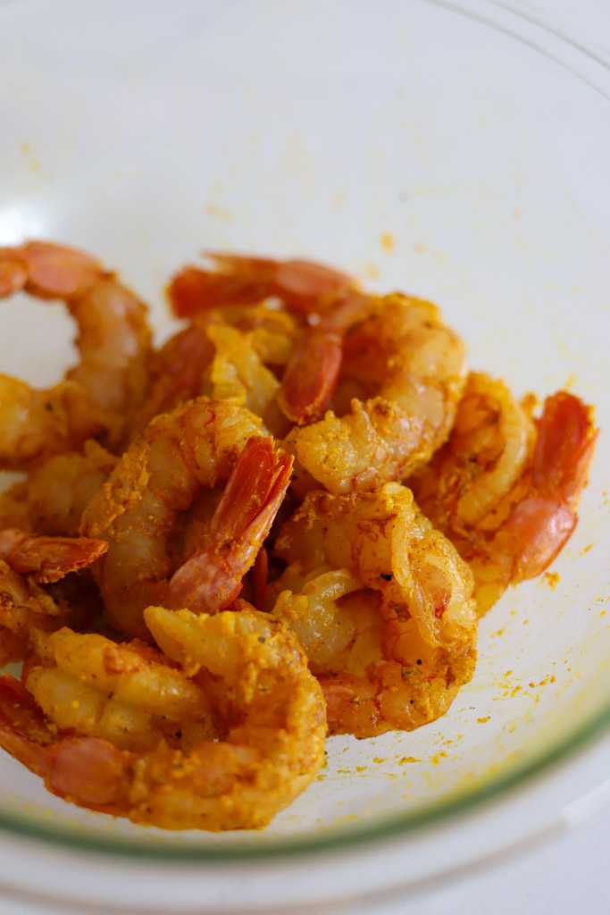 raw curry shrimp in a bowl.