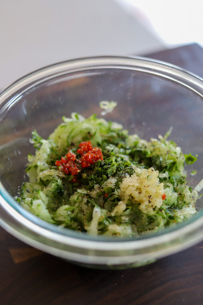 cucumber chutney ingredients combined in a bowl.