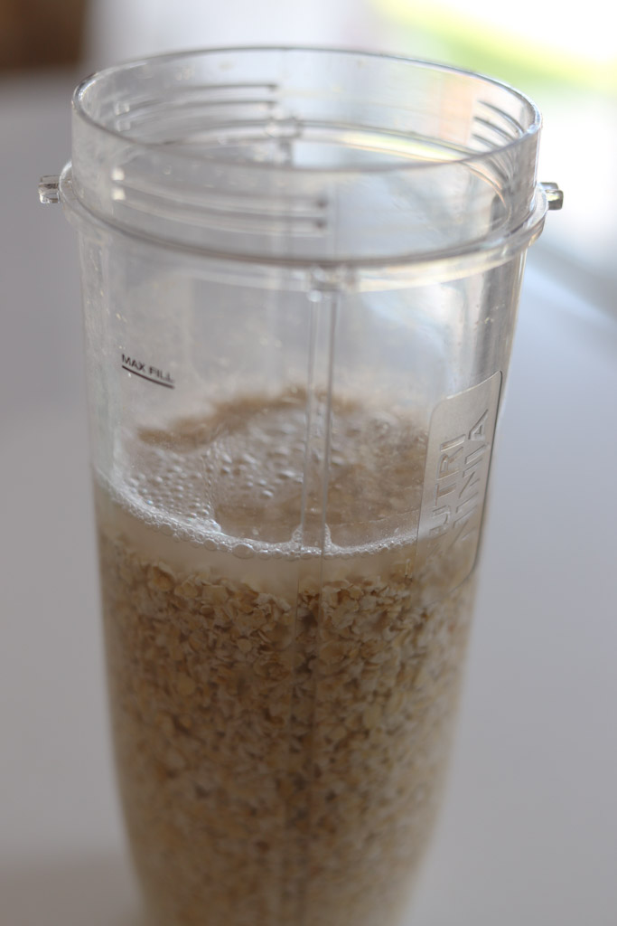 water and oats in a blender cup. 