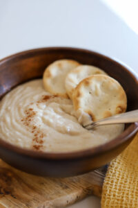 oats porridge in wooden bowl.