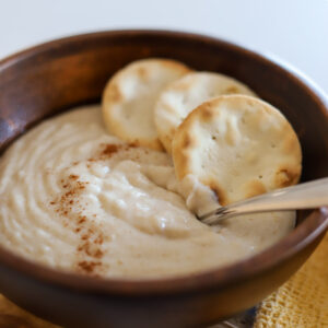 oats porridge in wooden bowl.