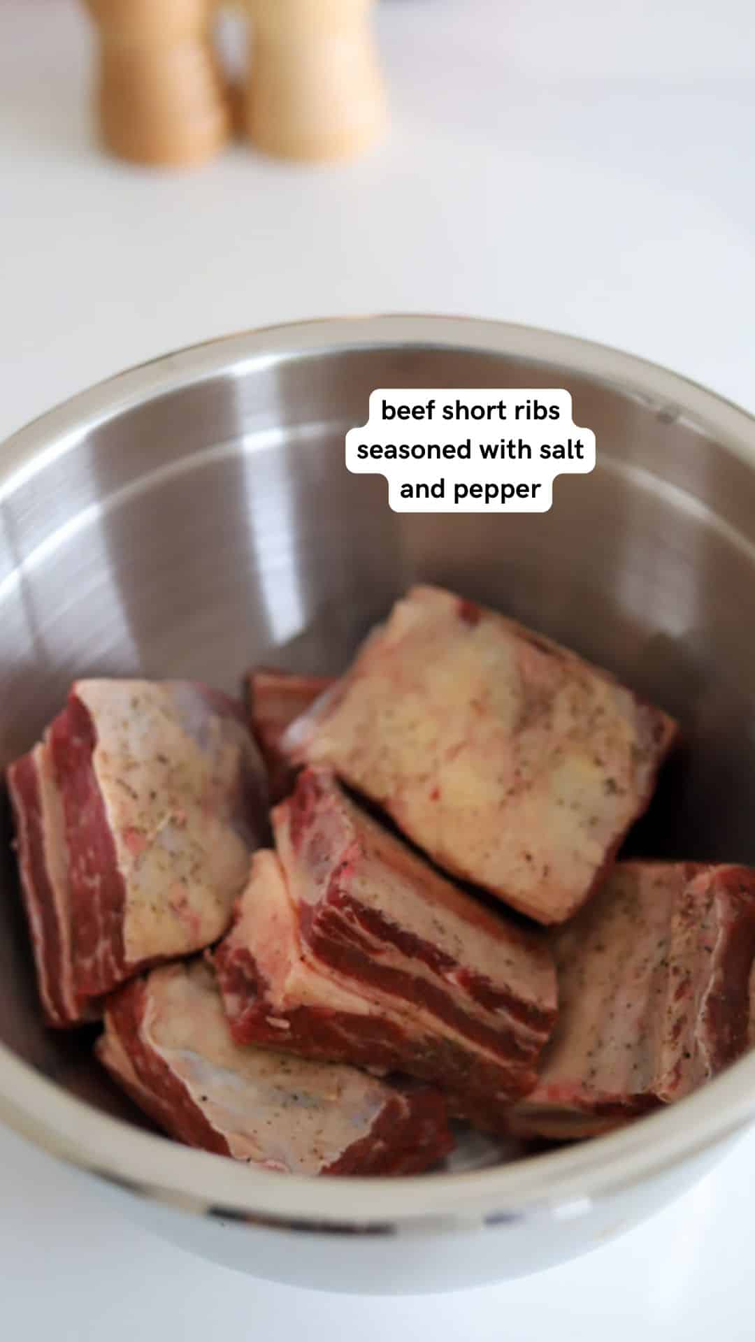 raw beef short ribs in bowl.