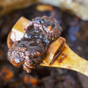 braised short rib in wooden spoon.