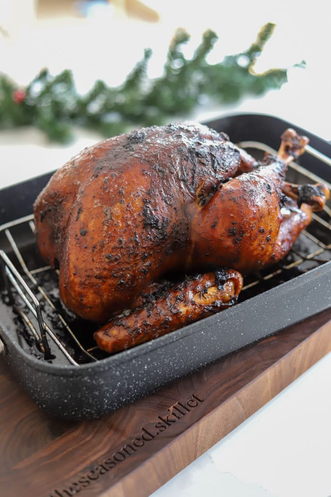 roasted turkey resting in a pan