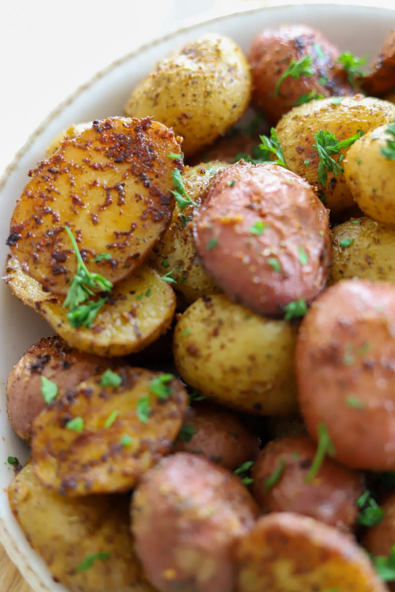 close up view of a bowl of roasted baby potatoes