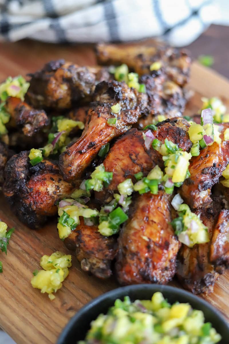 jerk chicken wings topped with pineapple salsa