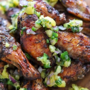 jerk chicken wings topped with pineapple sauce